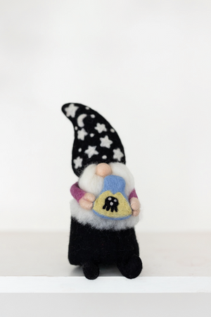 The Nivas Halloween Gnome - Wizard features a handmade design with a star and moon hat, holding a heart-shaped object adorned with a bee—perfect whimsical décor for Halloween.